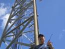 WX4NHC Assistant Coordinator Julio Ripoll, WD4R, at the base of the tower at the NHC.