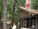 Under the ARRL flag, Nadia Scharlau is checking her 80 meter receiver at Copperas Creek campground. [Joe Moell, K0OV, Photo]