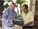 Representing the Radio Club Dominicano (RCD), Douglas Lapin, K1OY (left), presents Radio Club d’ Haiti President Jean-Robert Gaillard, HH2JR, with a repeater donated by the ARRL and the RCD. [Photo courtesy of Radio Club Dominicano]