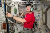 ISS ARISS Reid Wiseman inside a contron room.