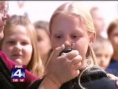 A girl speaking into a microphone.